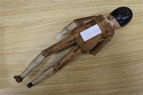 A 19th century folk art peg doll 36cm.